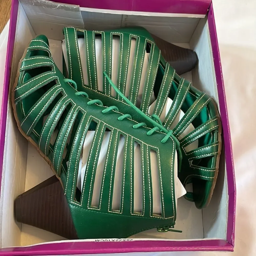 RASOLLI GREEN LACE UP CUT OUT SHOOTIES.  ZIP UP BACK. NEW IN BOX